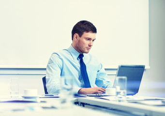 Fototapeta premium businessman with laptop working in office
