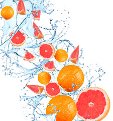 Fototapeta na wymiar Fresh fruit in water splash, falling grapefruit