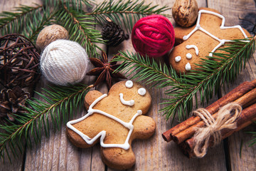 Christmas tree background with Christmas tree and gingerbread shaped cookies. the toning. selective focus