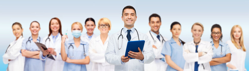 Fototapeta premium group of doctors with tablet pc and clipboard