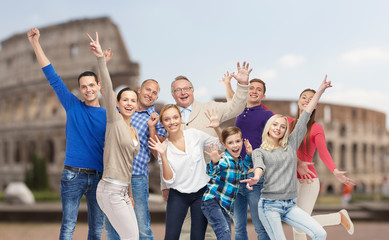 Obraz premium group of happy people having fun over coliseum