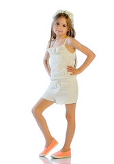 Portrait of a smiling girl looking at the camera. Studio shot, isolated on white.