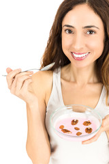 Woman eating a bowl of yogurt