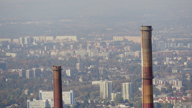 two chimneys generating high pollution and causing global warming aerial view