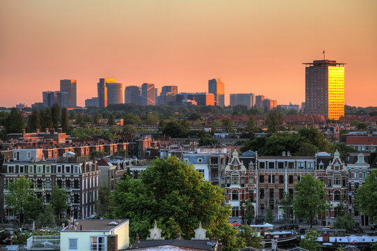 Beautiful cityscape looking over the city of Amsterdam in the Netherlands at sunset.
