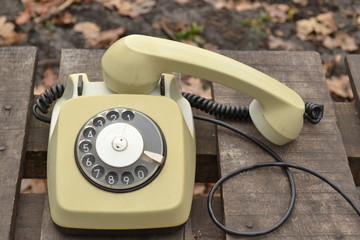 old telephone on a wooden table