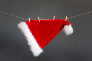 Red Christmas hat hang on rope, Merry Christmas