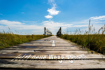 Obraz premium Jetzt neue Wege gehen Schild