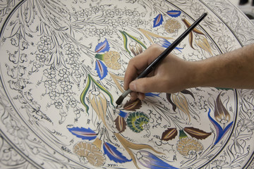 Painting of porcelain by hand. A traditional iznik ( Nicea )patt