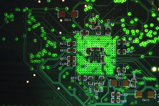 Printed circuit board closeup green electronic background