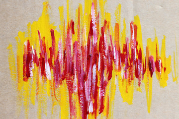 Brush stroke red and yellow on brown paper