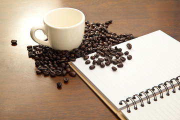 White book and coffee beans
