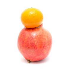 pomegranate and tangerine on a white background