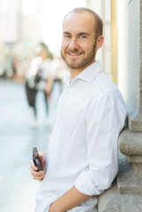 Smiling man with phone