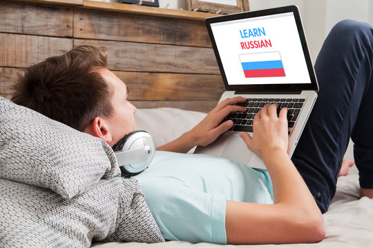Man learning russian at home.