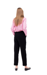 back view of standing young beautiful  woman.