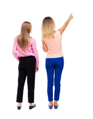 Fototapeta premium Back view of two pointing young girl. Rear view people collectio