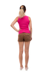back view of standing young beautiful  woman.