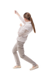 back view of standing girl pulling a rope from the top or cling