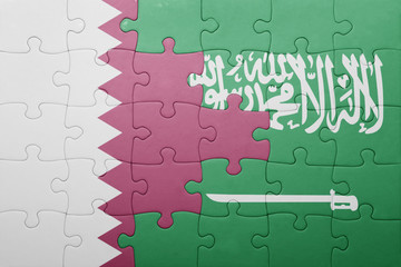 puzzle with the national flag of saudi arabia and qatar