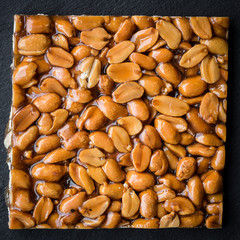 Peanut brittle on black background