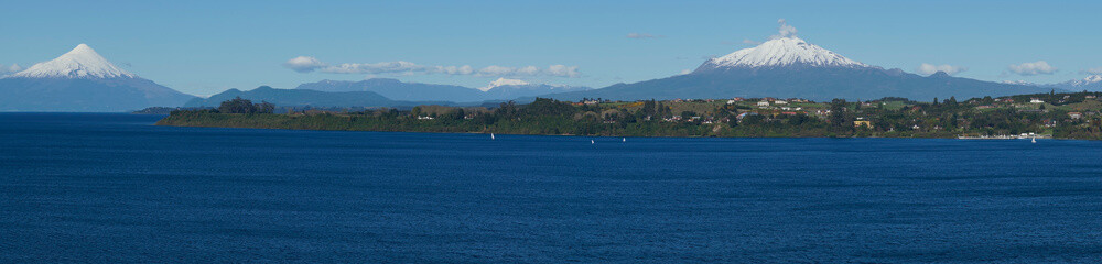 Snow capped Volcanoes Osorno (2,652 metres) and Calbuco (2,105 metres) on the edge of Llanquihue...