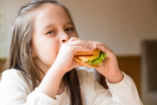 Girl eating hamburger
