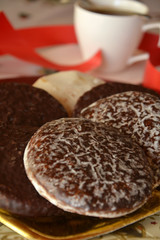 Detail of delicious Christmas cookies with cup of coffee on a table 