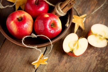 Red apples with cinnamon in a bowl
