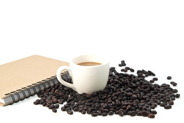 Cup of coffee and beans on white background