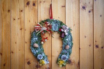 Christmas wreath on the wooden doors