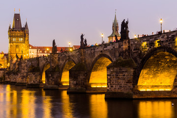 View at The Charles Bridge and Vltava river in Prague in dusk at sunset, Czech Republic