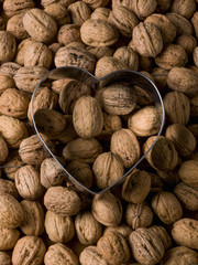 Close-up of a large group of walnuts with a heart above