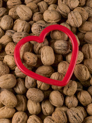 Close-up of a large group of walnuts with a heart above