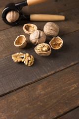 walnuts with nutcracker on a rustic table