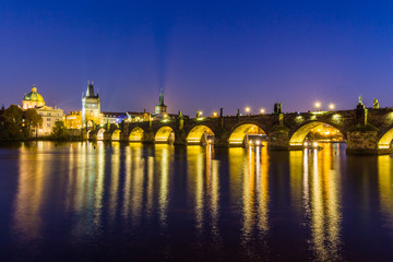 View at The Charles Bridge and Vltava river in Prague in dusk at sunset, Czech Republic