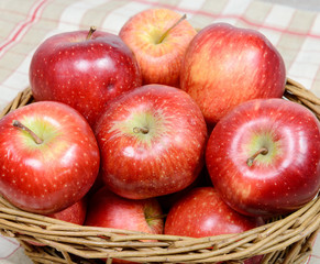 Red apples in a basket wicker