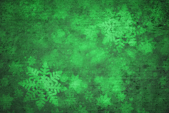 Magical grunge green colored shiny abstract blurry textured snowflake shapes illustration background. Dreamy winter snowfall copy space greeting card background. 