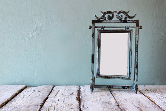 low key image of old victorian steel blue blank frame
