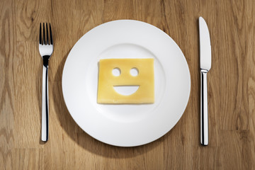 Cheese with smiling face on a table