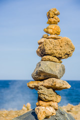 Fototapeta na wymiar Stack of stones on sea shore, Aruba