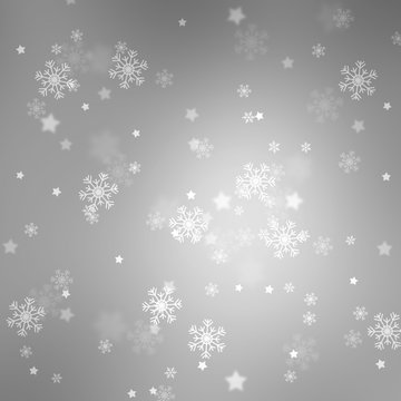 Silver colored blurry bokeh with blurred star shapes and snowflakes. Magic Christmas and New Year snowy Holiday greeting card copy space background.