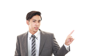 指示する笑顔のビジネスマン