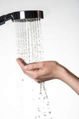 Obraz na płótnie Canvas female hands under the stream of water from shower