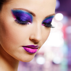 Female face with purple fashion makeup