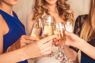 Closeup photo of girls celebrating a bachelorette party of bride