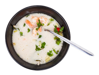 top view of sour and spicy soup Tom yam in bowl