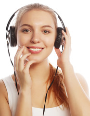 Woman with headphones listening music . Music teenager girl isol