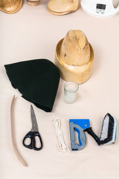 felt hood, wooden hat-block, tools for hatmaking