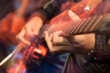 aggressive play guitar on stage